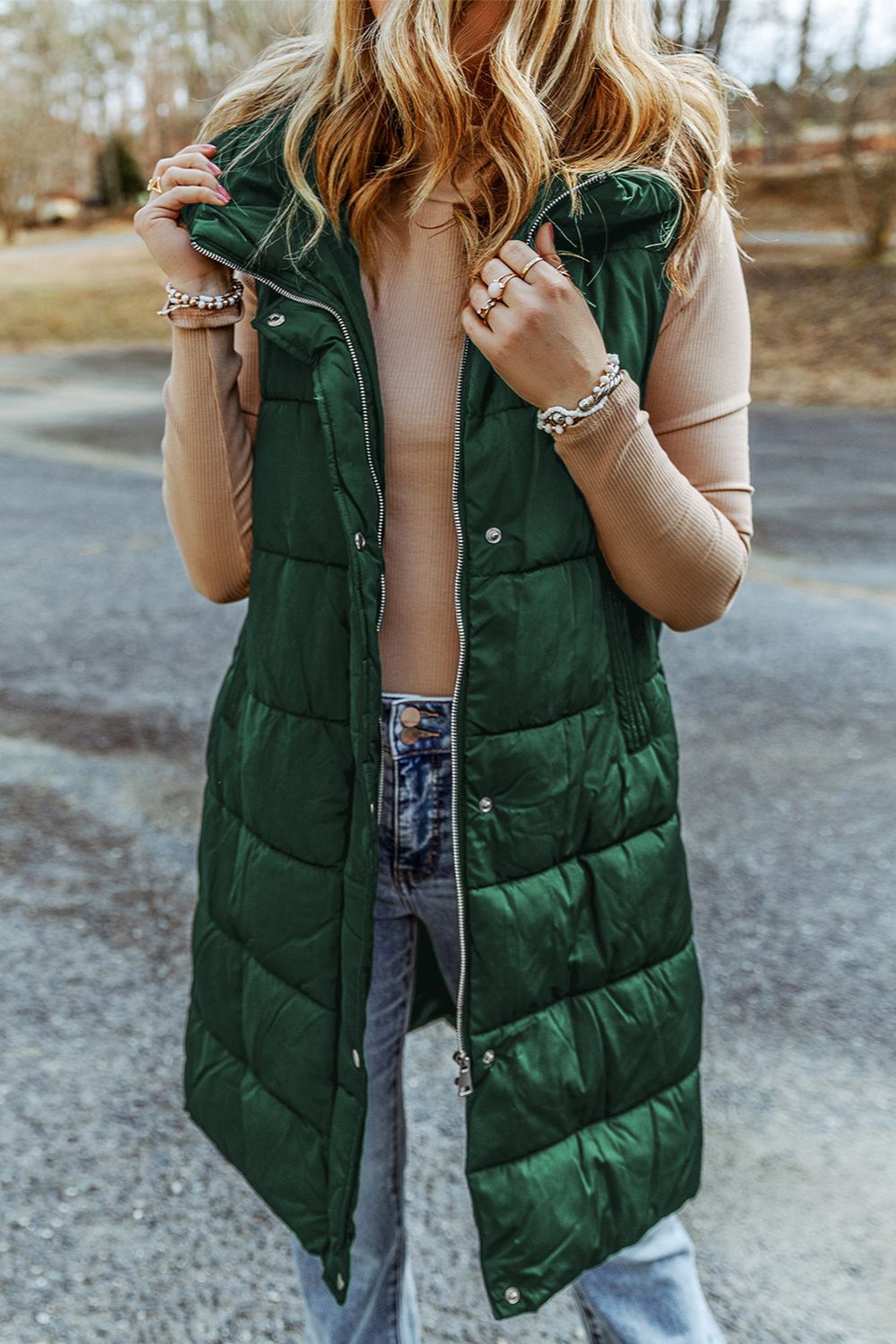 Longline hooded puffer vest in green with a full zip front and quilted detail.