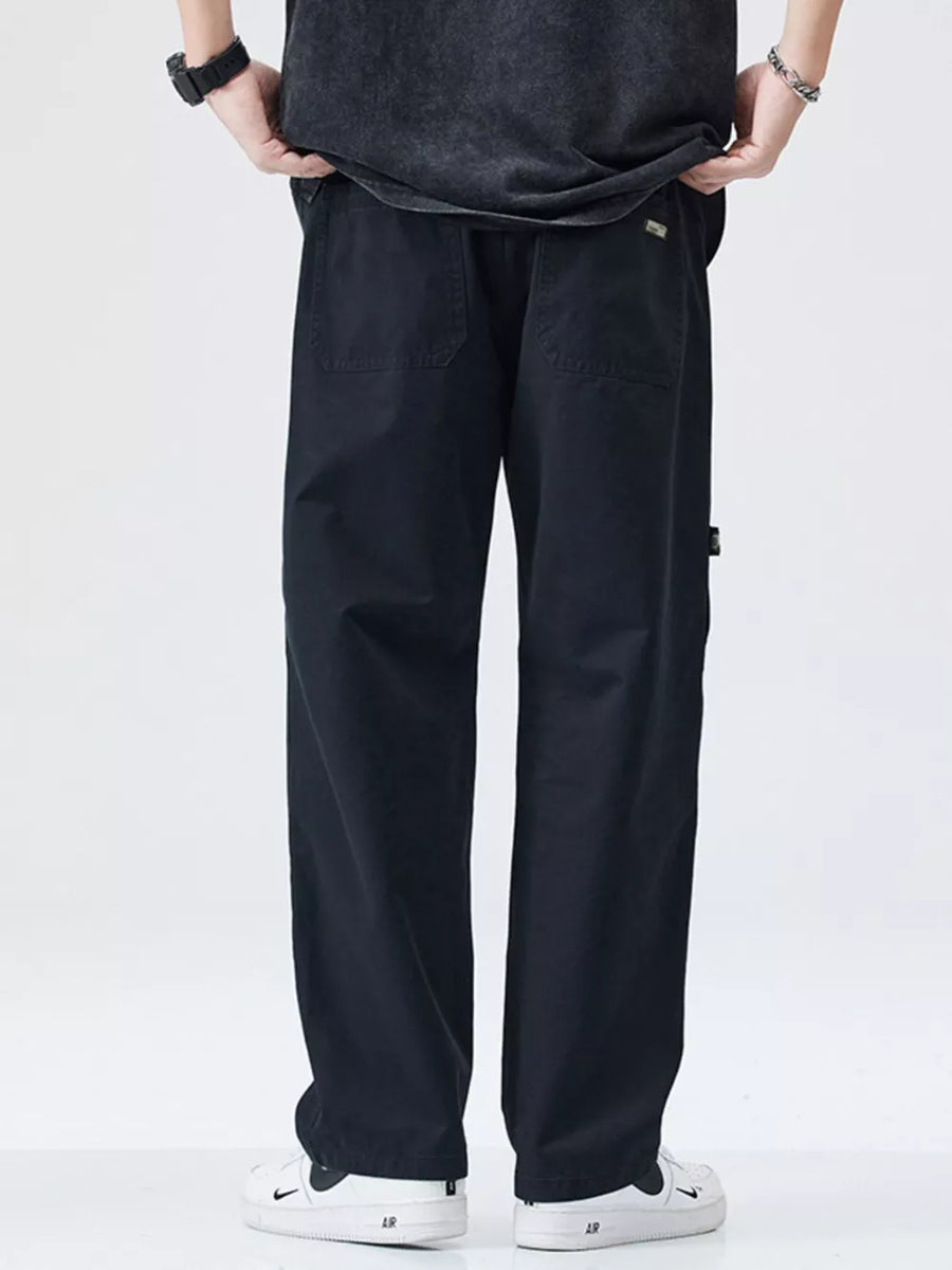 Black loose-fit cargo pants with back pockets and utility details.
