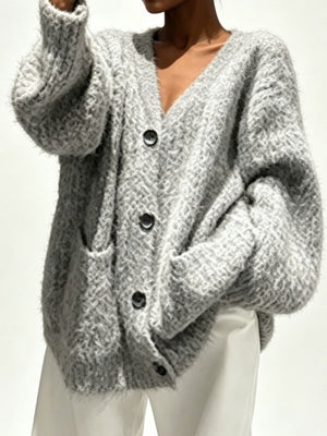 cardigan in light gray featuring buttoned and oversized fit