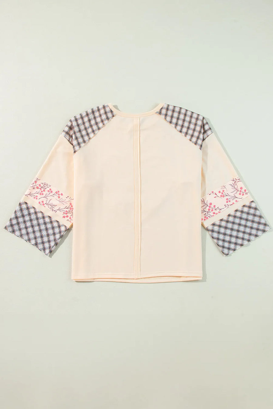 Patchwork heart raglan top in tan with plaid and floral print sleeves.