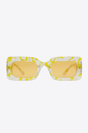 Swirl print rectangular frame sunglasses in Butter Yellow with orange lenses.