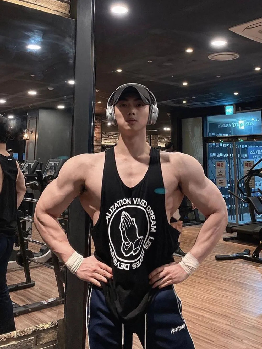 Black tank top with praying hands graphic and text detail