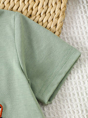 Light green cotton baby tee with embroidered tractor detail, short sleeves, crew neck.