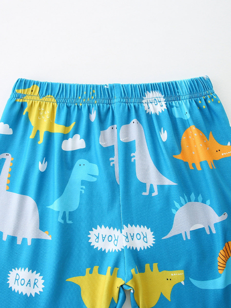 Kids' blue dinosaur print pajama shorts with elastic waistband and playful ROAR text.