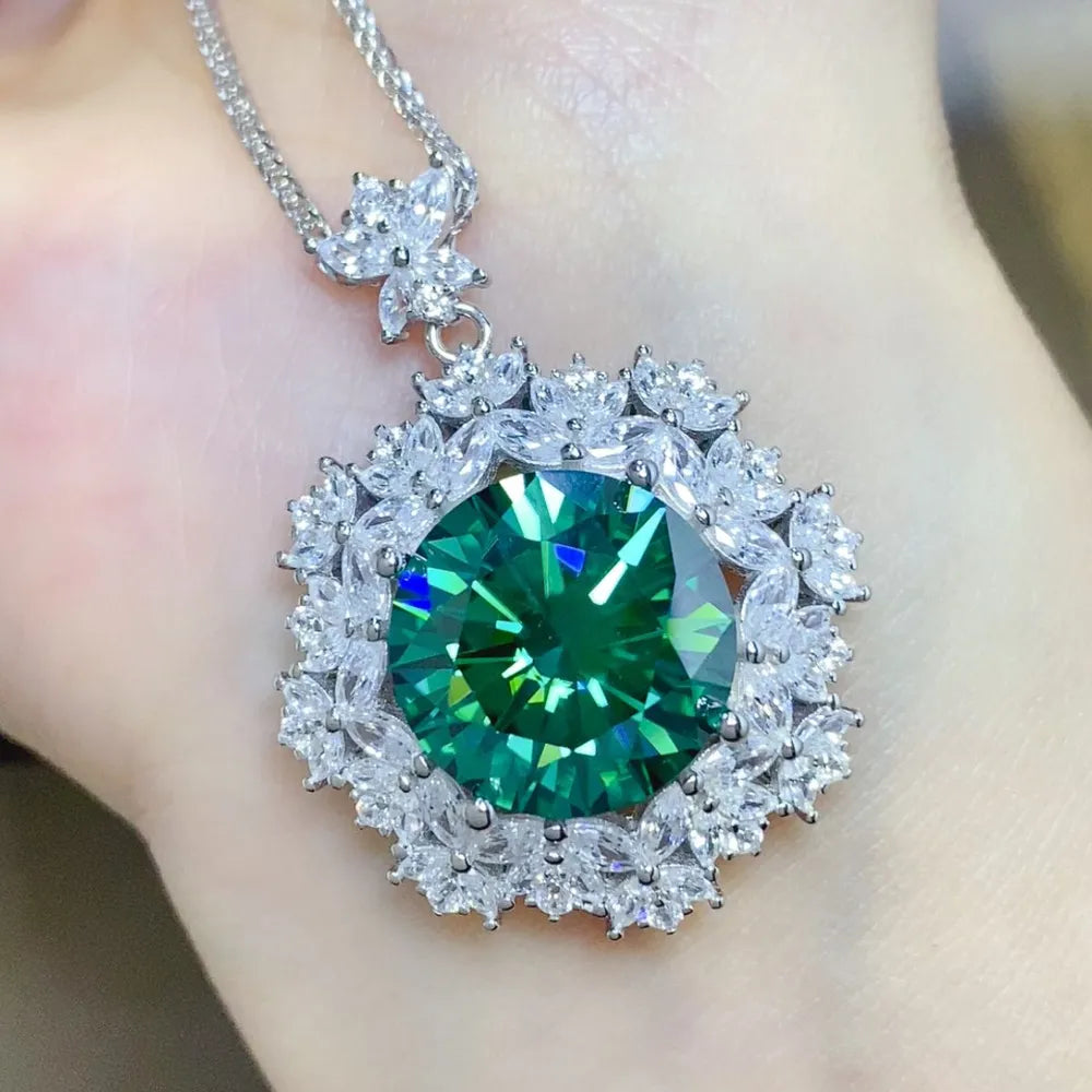 Silver necklace with large emerald halo moissanite pendant and crystal accents.