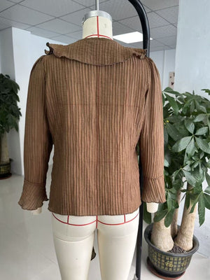100% polyester Care instructions: Machine wash cold blouse in Brown with relaxed silhouette