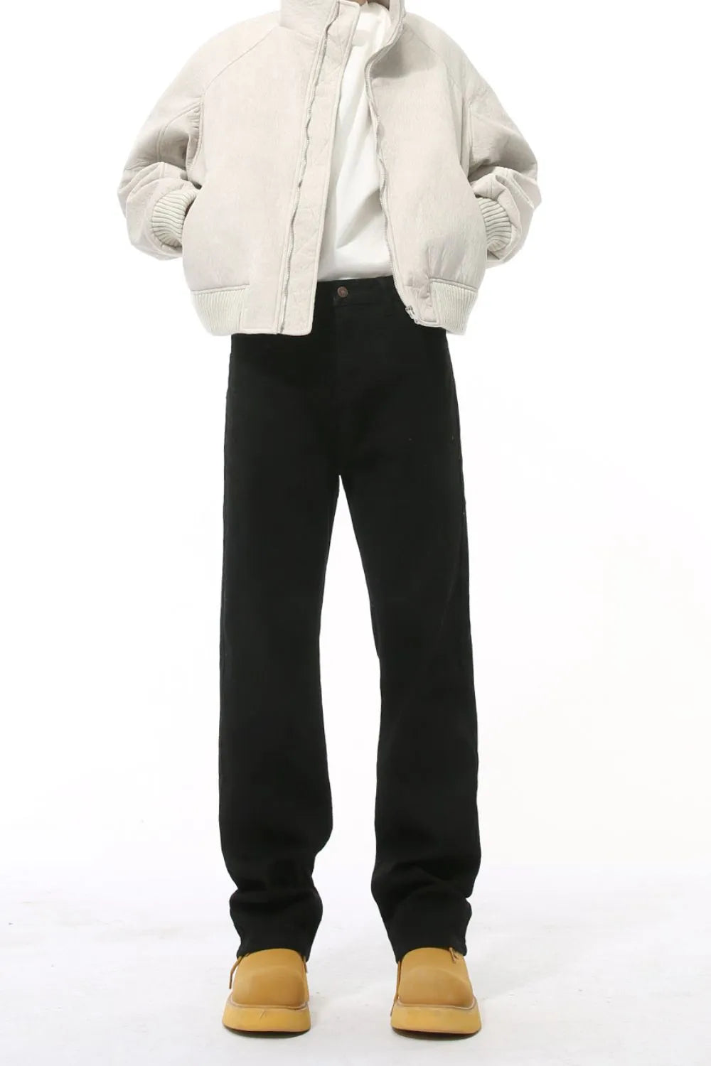 Split-hem tailored black denim jeans with a straight leg cut.
