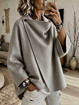 100% polyester Care instructions: Machine wash cold cape in Burgundy with oversized silhouette