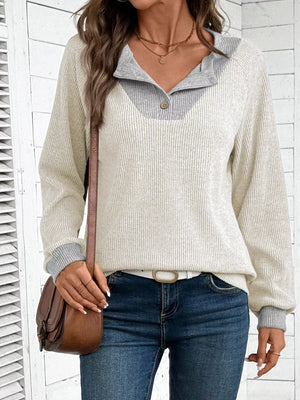 Chic ribbed two-tone maternity shirt in ivory and gray with buttoned collar detail.