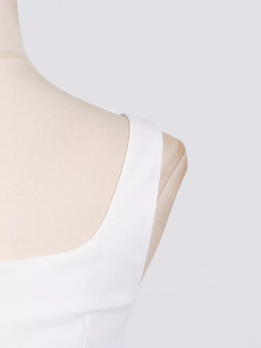 White sleeveless square neck top with thick straps.