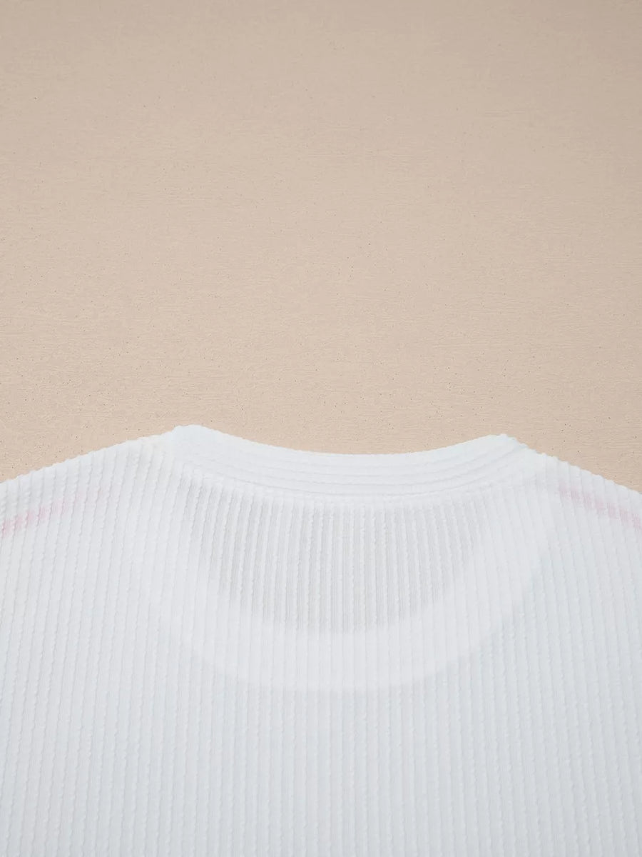 White ribbed maternity t-shirt with subtle contrast stitching detail on the neckline.