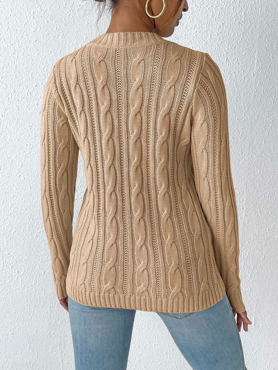 Camel cable knit acrylic sweater with mock neck and long sleeves.
