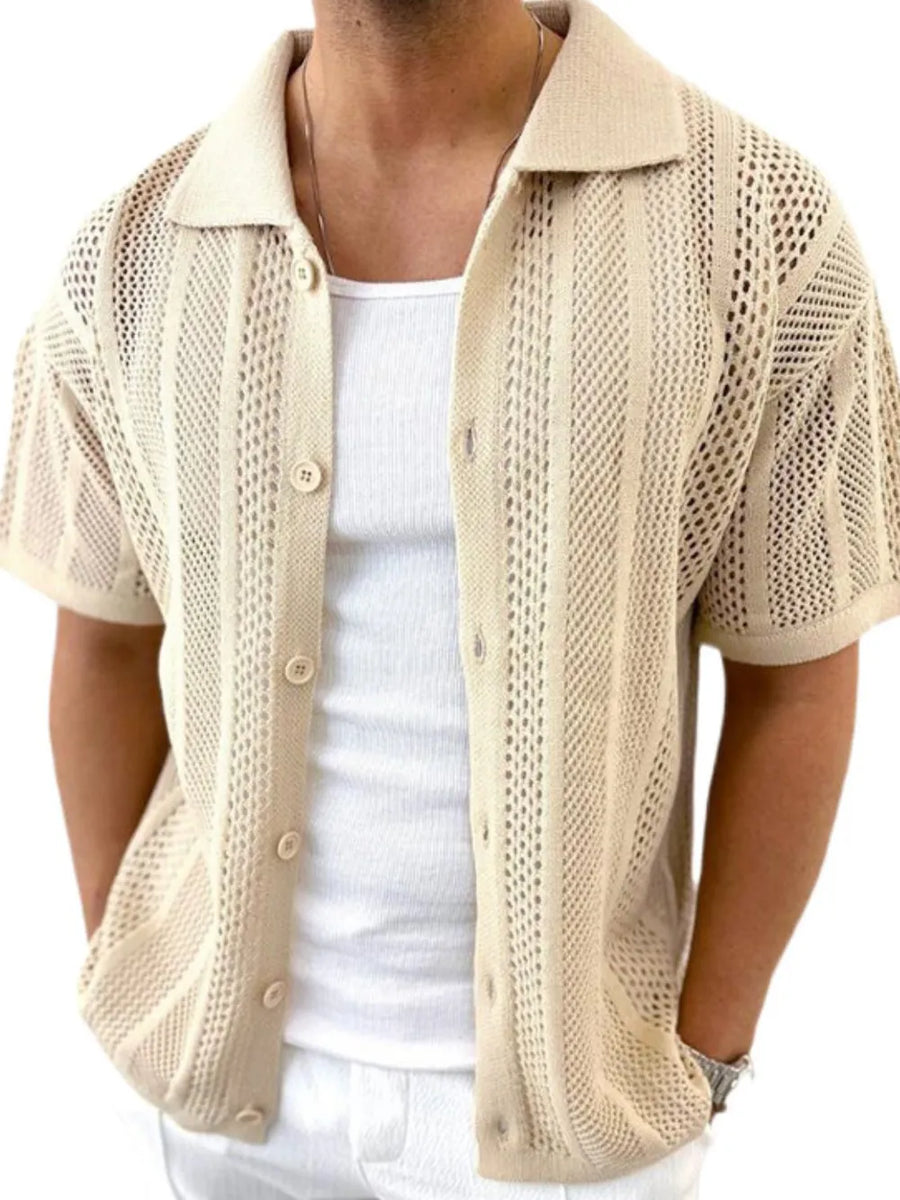 Beige open-knit resort shirt with short sleeves and a collared neckline, styled with a white tank top.