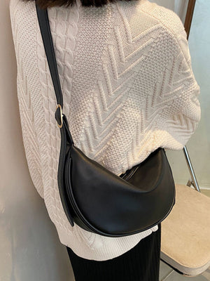 Black crescent pu leather crossbody bag with gold buckle detail