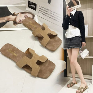 H-Strap suede sliders sandals in beige with a square toe.