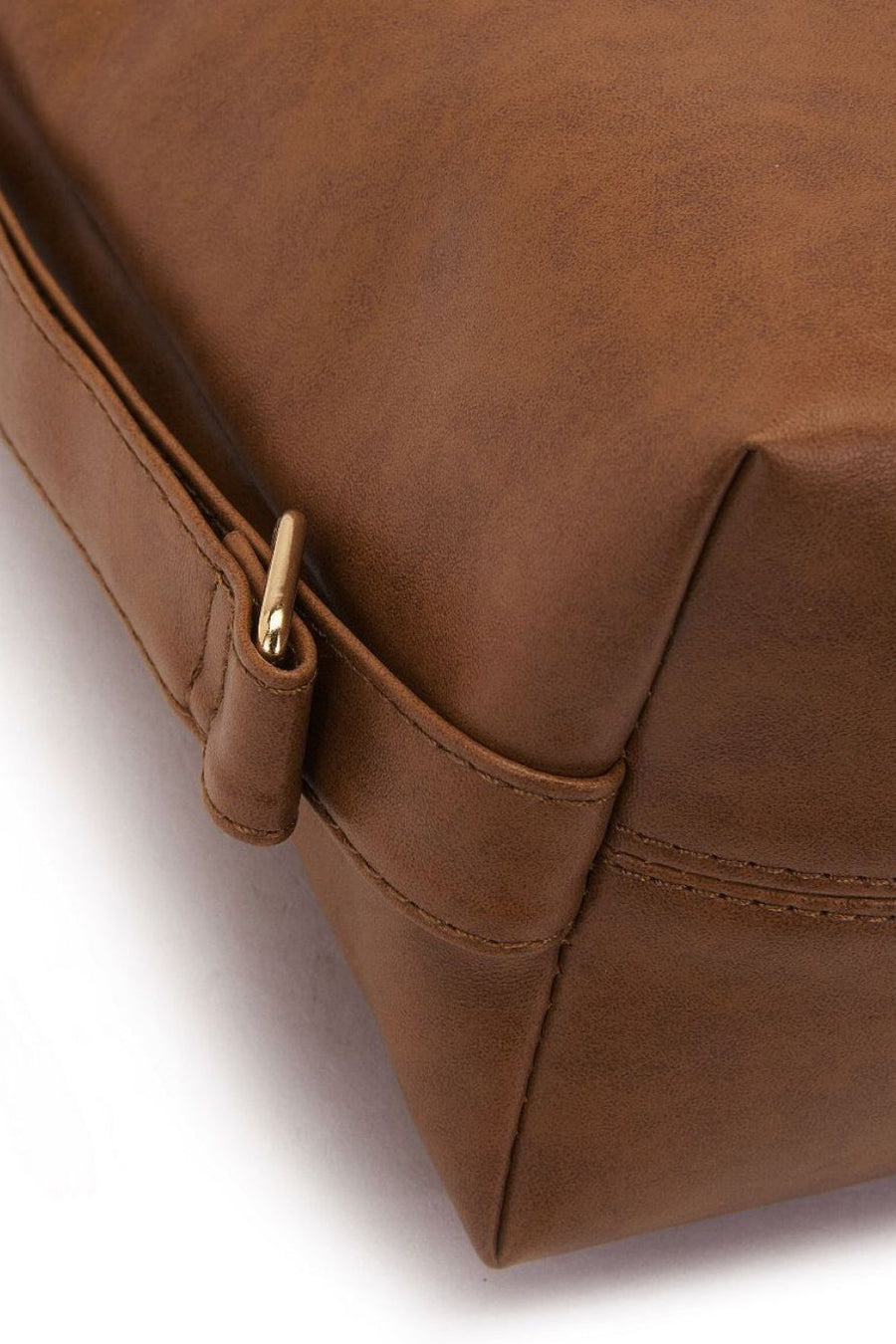 Earthy slouchy shoulder bag in chocolate brown faux leather with gold hardware detail.