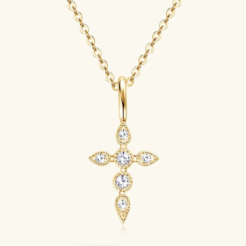 Gold diamond-set cross pendant necklace with a delicate chain.