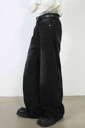 Oversized black wash denim jeans with a wide leg and casual fit.