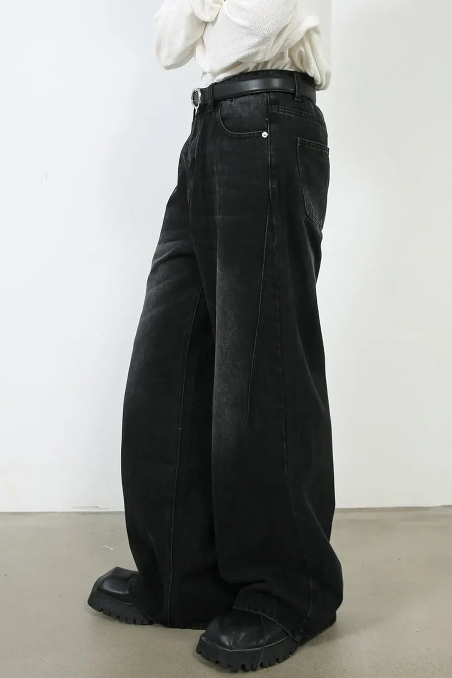 Oversized black wash denim jeans with a wide leg and casual fit.