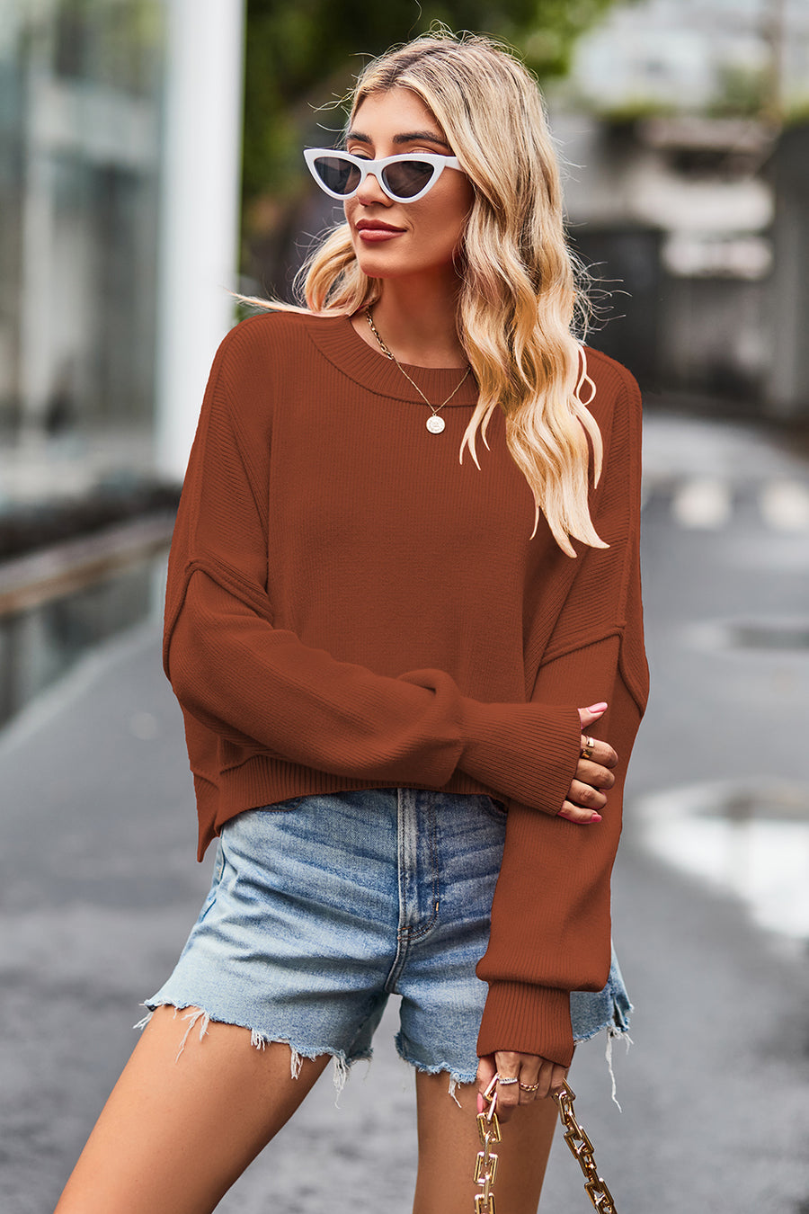 Cropped ribbed knit sweater in caramel with batwing sleeves and crewneck.