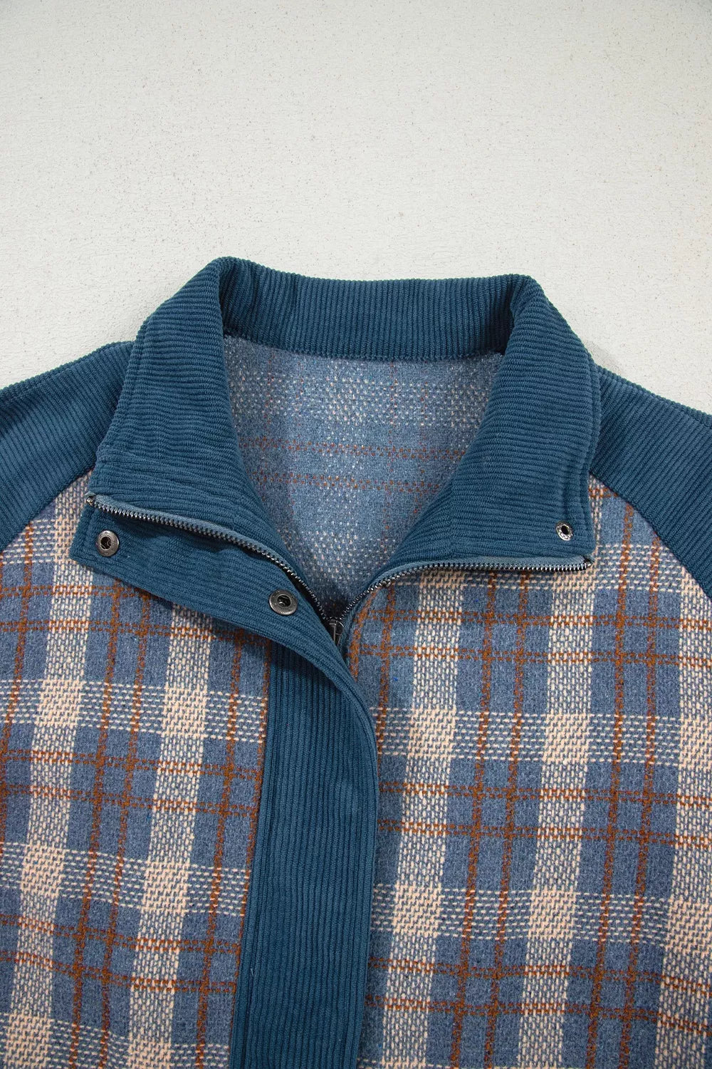 beige jacket with zip-front and plaid