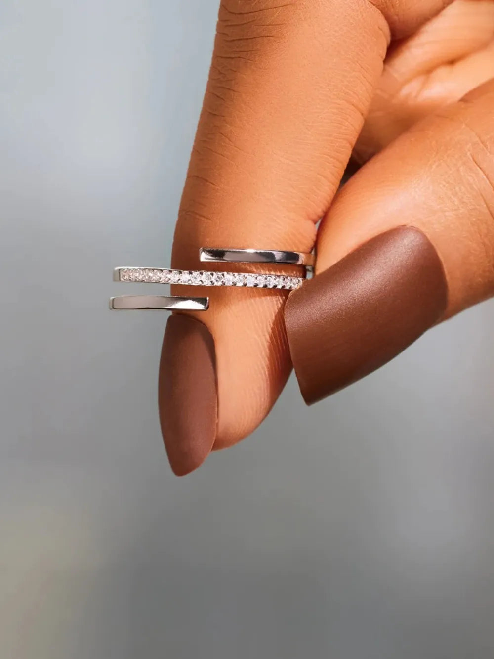 Silver double band open ring with pavé zirconia detail.