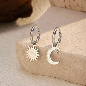 earrings in silver with geometric and dangle charm