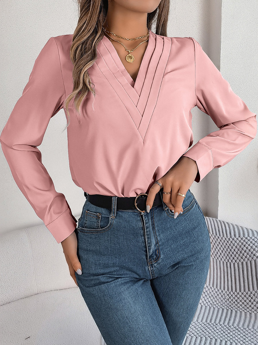 Dusty Pink V-neckline blouse with pleated detail and long sleeves.