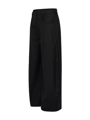 Voluminous wide-leg black sweatpants with pockets and a button closure.