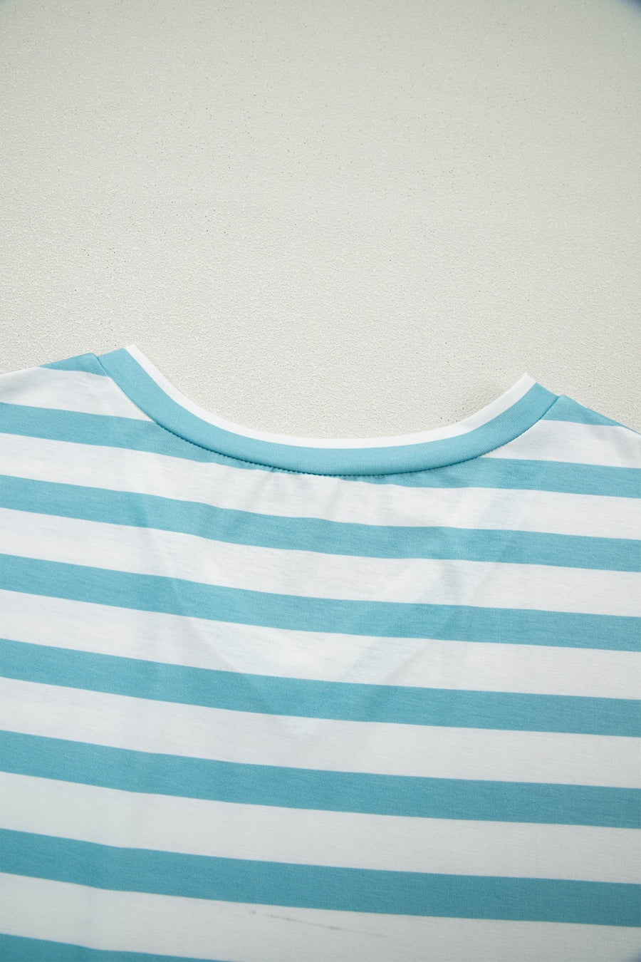 Striped teal and white V-neck t-shirt with elastane for comfort.
