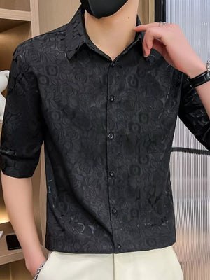 Black floral jacquard button-up shirt with short sleeves.