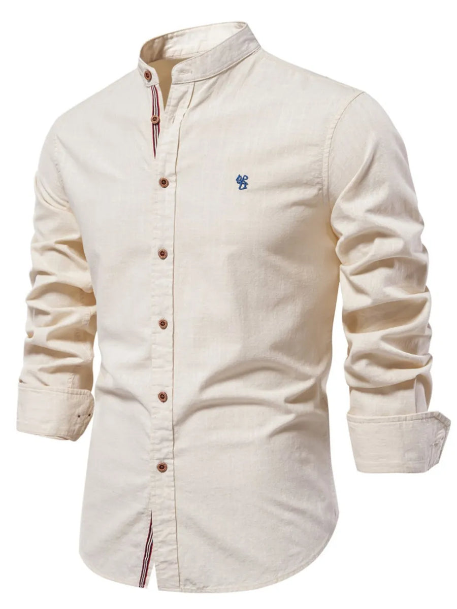 Light beige linen shirt with mandarin collar and blue embroidered detail.