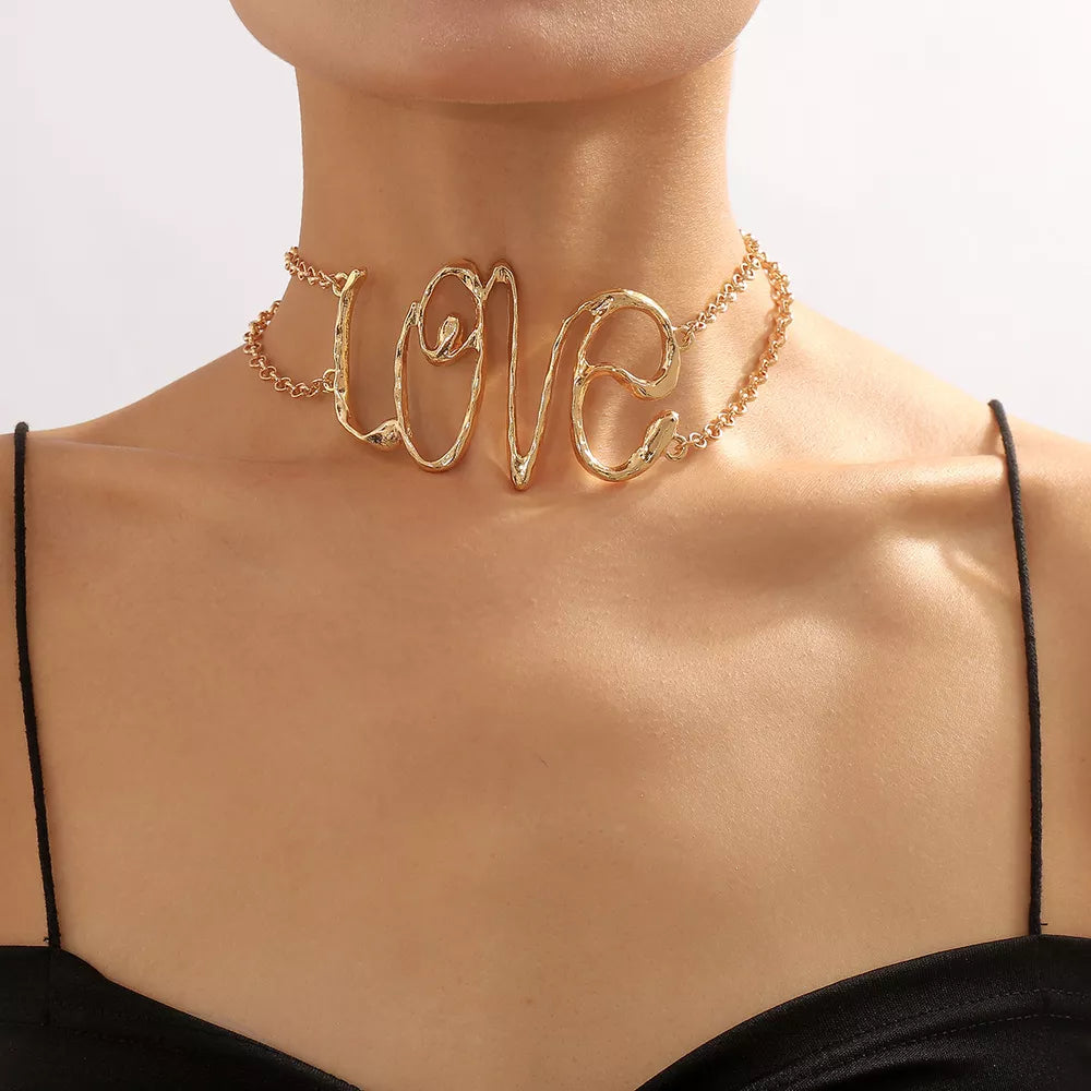 gold necklace with script and n/a