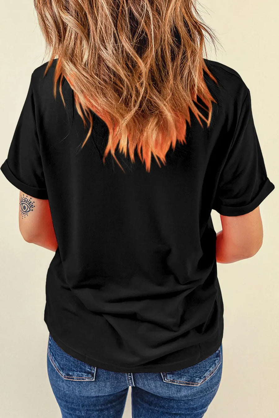 Black casual t-shirt with rolled sleeves and a graphic detail on the left sleeve.