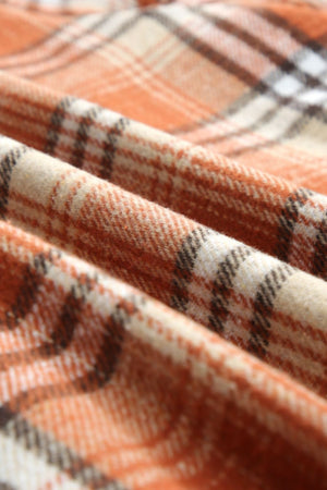 Sherpa-lined overshirt jacket in tangerine plaid fabric with a soft texture.