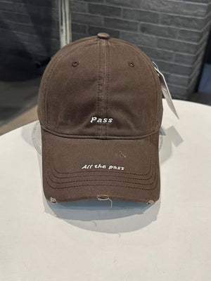 Brown cotton baseball cap with embroidered slogans and distressed details.