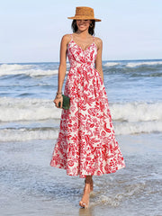 Floral faux-wrap midi dress with red print, V-neck, spaghetti straps, and defined waist.
