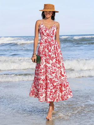 Floral faux-wrap midi dress with red print, V-neck, spaghetti straps, and defined waist.