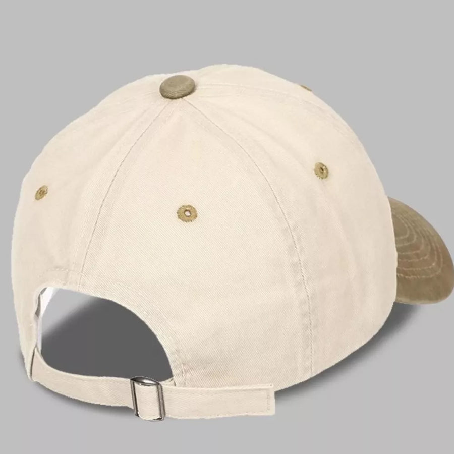 Cream baseball cap with tan brim and adjustable strap