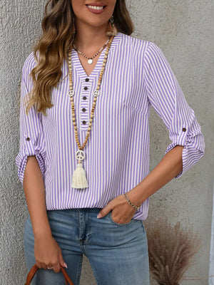 Purple stripe V-neck blouse with roll-up sleeves and button detail.