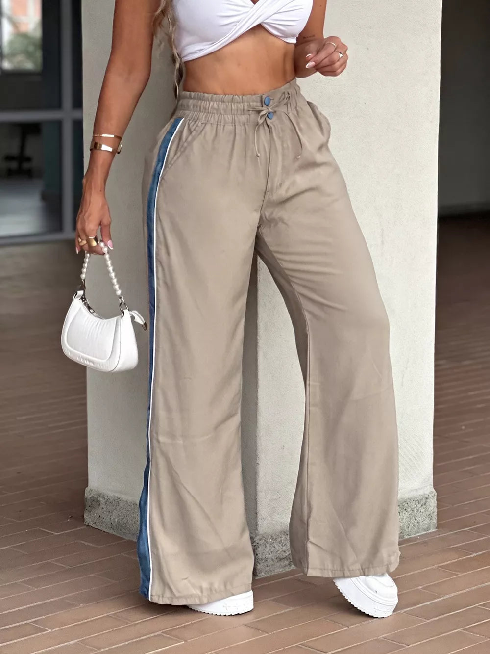 Khaki wide-leg pants featuring drawstring waist and color-block