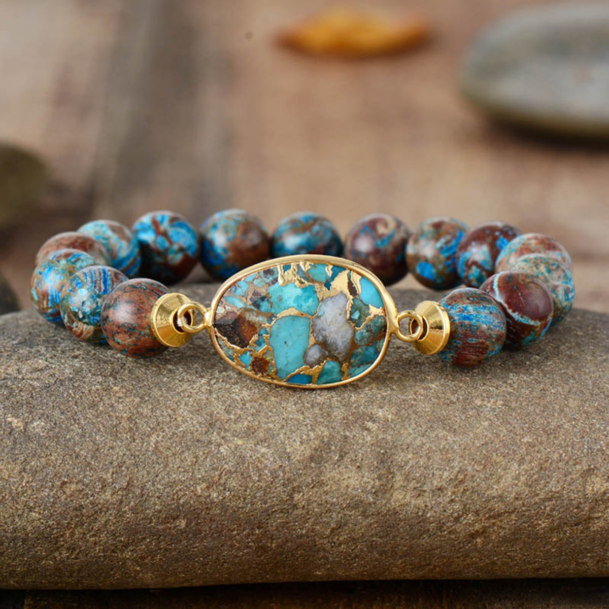 Verdant Stone & Orb Bracelet in gold with aqua and brown beads.