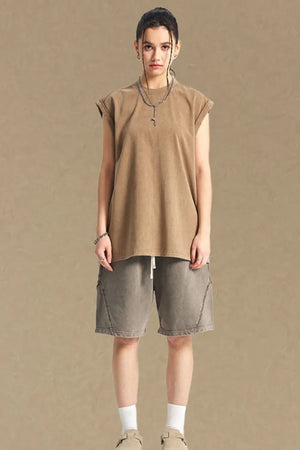 Washed cotton muscle tee in tan, relaxed fit, sleeveless, crew neck.