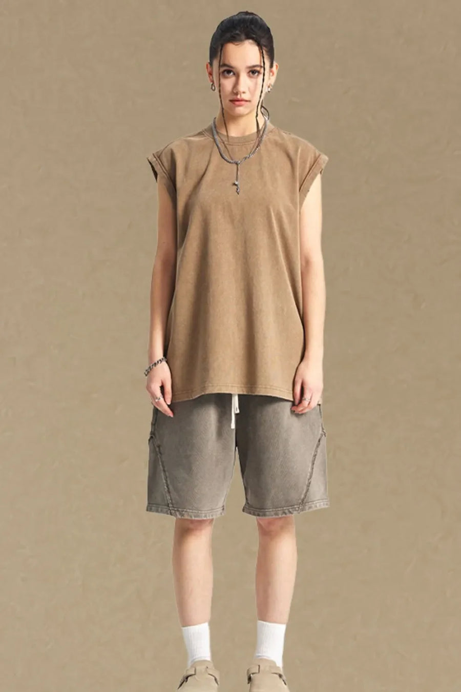 Washed cotton muscle tee in tan, relaxed fit, sleeveless, crew neck.