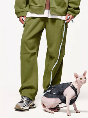 Men's relaxed fit moss cargo pants with side pockets and light blue trim detail.