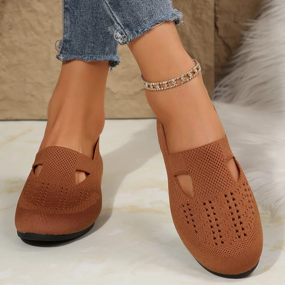 Caramel knit slip-on flats with cutout details and perforated pattern.