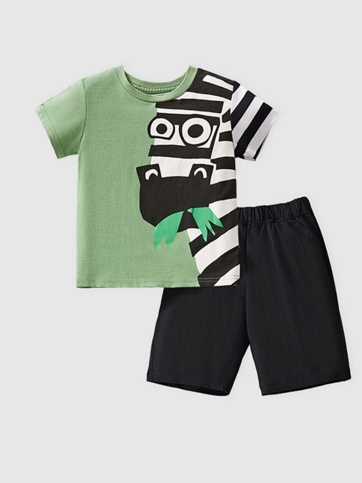 Green cotton tee with playful zebra graphic and black shorts.