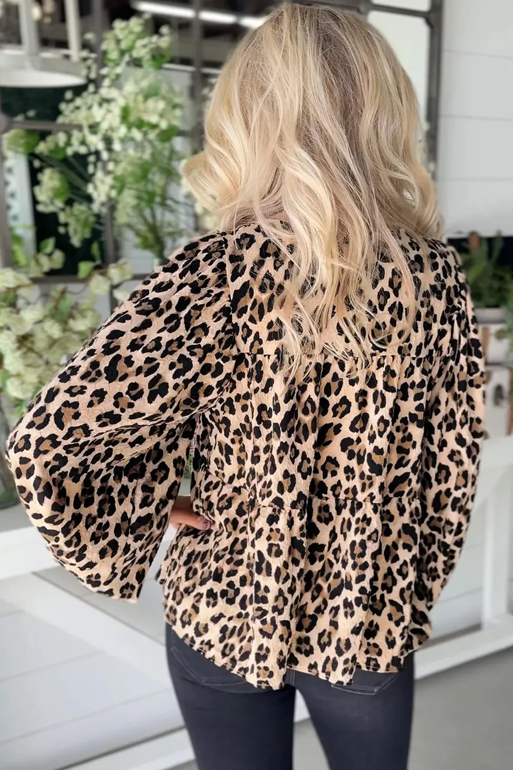 brown blouse featuring tie-neck and leopard-print
