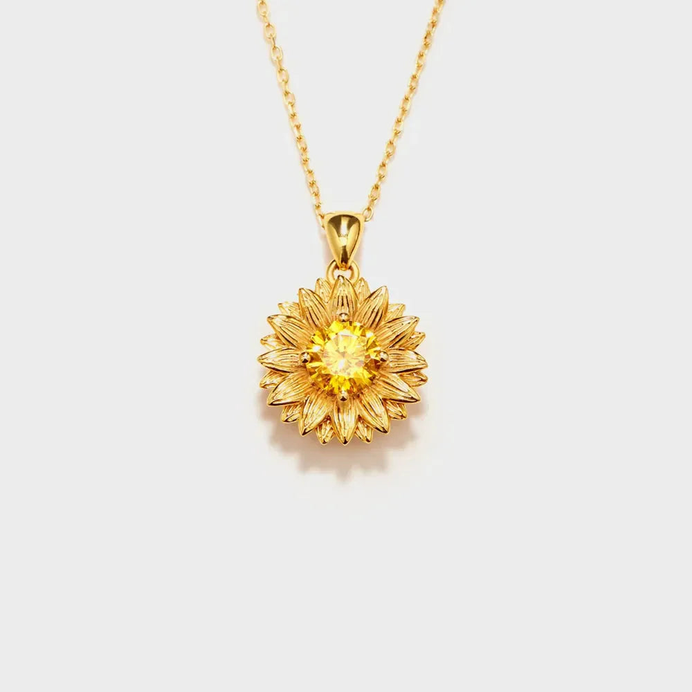 Gold sunflower pendant necklace with yellow gemstone center