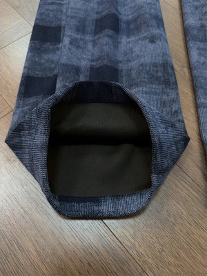 navy blue wide-leg pants featuring drawstring waist and plaid